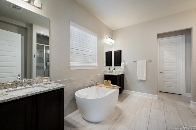 16106 Salto Del Agua, San Antonio, TX 78255 - full bath featuring tile patterned flooring, a freestanding bath, visible vents, a sink, and a stall shower
