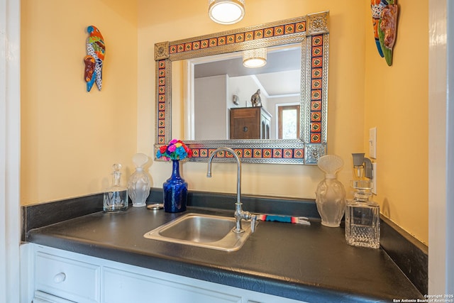 details featuring indoor bar and a sink