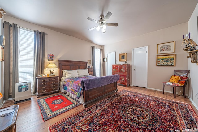 bedroom with ceiling fan and wood finished floors