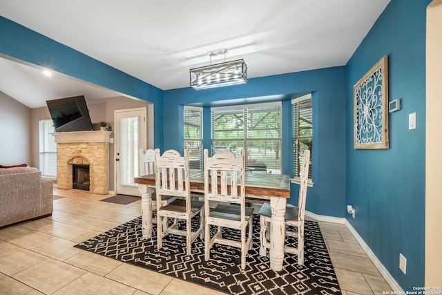 170 Pullman Rd, La Vernia, TX 78121 - dining space with a stone fireplace, tile patterned floors, and baseboards