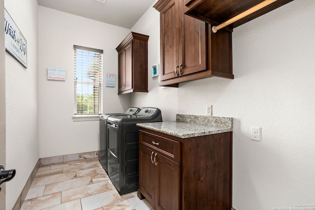 laundry room featuring cabinet space, independent washer and dryer, marble finish floor, and baseboards