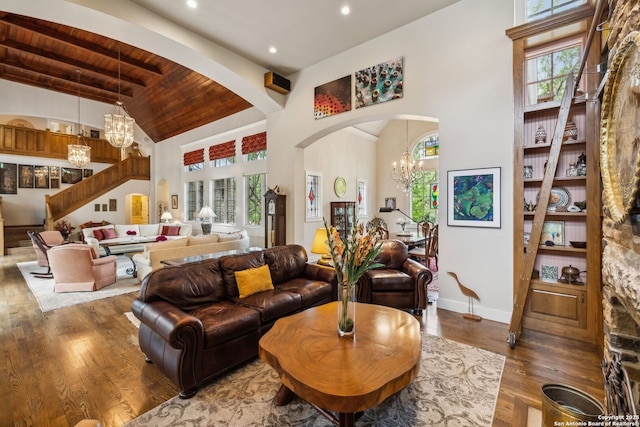 110 Turnberry Way, San Antonio, TX 78230 - living room with plenty of natural light, arched walkways, a chandelier, wooden ceiling with exposed beams, and wood finished floors