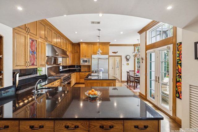 110 Turnberry Way, San Antonio, TX 78230 - kitchen featuring under cabinet range hood, built in appliances, an island with sink, healthy amount of natural light, and recessed lighting