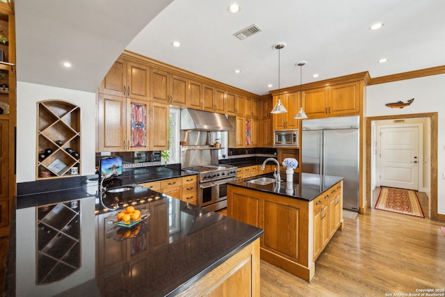 110 Turnberry Way, San Antonio, TX 78230 - kitchen with built in appliances, under cabinet range hood, a sink, a center island with sink, and light wood-style flooring