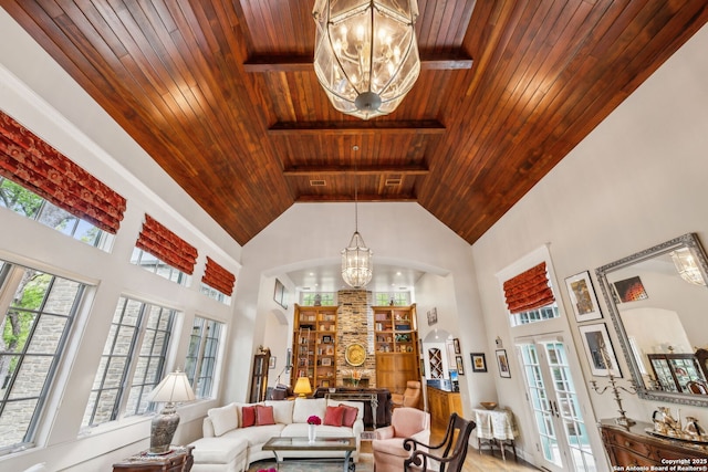 110 Turnberry Way, San Antonio, TX 78230 - living area with wood ceiling with exposed beams, a chandelier, a high ceiling, french doors, and healthy amount of natural light