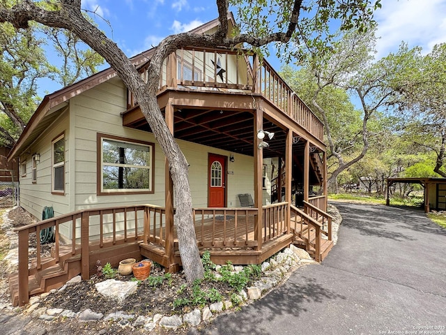 209 Lake Frst, Canyon Lake, TX 78133 - rustic home with aphalt driveway and a deck