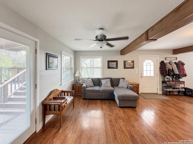 209 Lake Frst, Canyon Lake, TX 78133 - living area featuring beamed ceiling, baseboards, wood finished floors, and ceiling fan