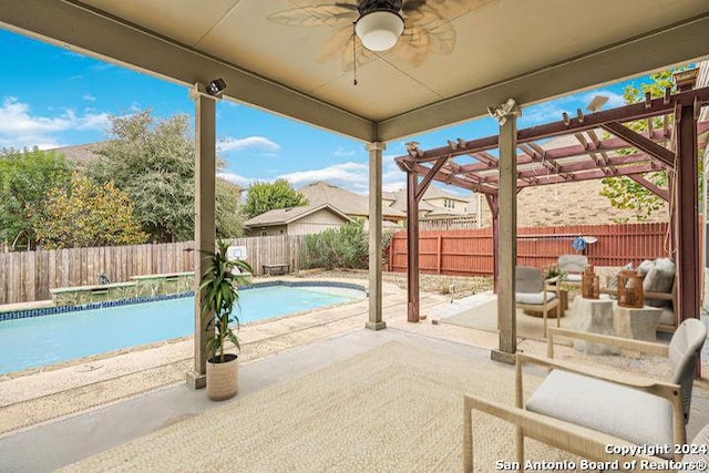 view of swimming pool featuring a fenced backyard, a patio area, a fenced in pool, and ceiling fan