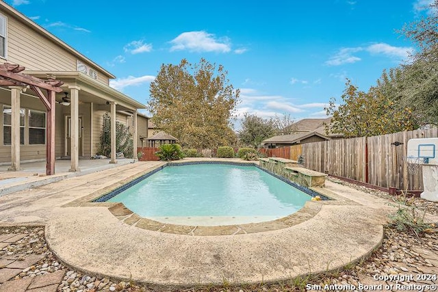 view of swimming pool with a patio area, a fenced in pool, and a fenced backyard