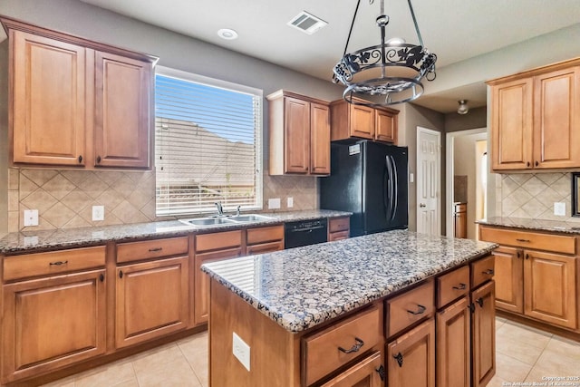 kitchen with light tile patterned floors, visible vents, a sink, and black appliances