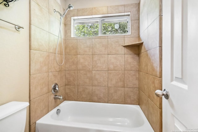 bathroom featuring toilet and bathing tub / shower combination