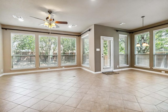 interior space with plenty of natural light, visible vents, and a ceiling fan