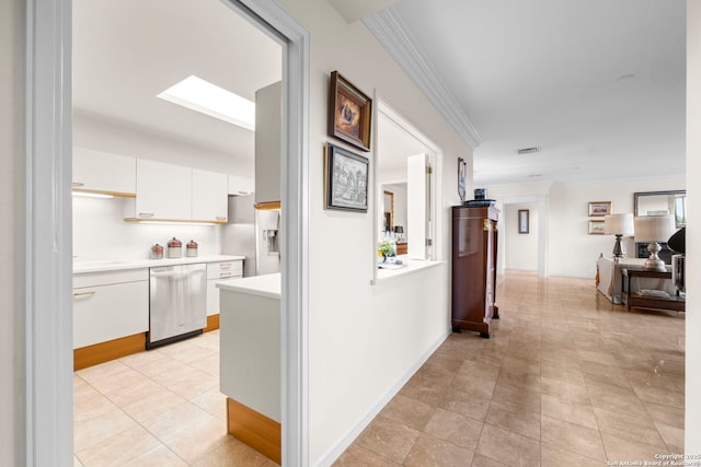 hallway featuring baseboards, ornamental molding, visible vents, and light tile patterned floors
