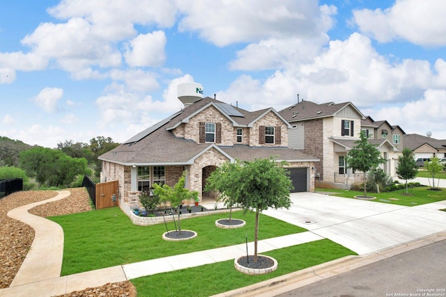 2243 Sur, New Braunfels, TX 78132 - traditional home with driveway, brick siding, roof mounted solar panels, a garage, and roof with shingles