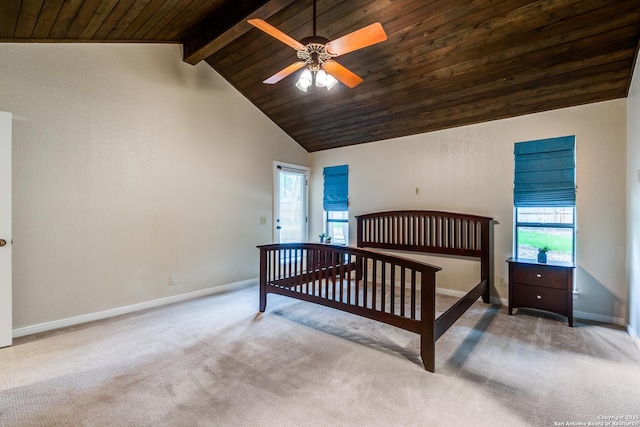 carpeted bedroom with beamed ceiling, wooden ceiling, baseboards, and multiple windows