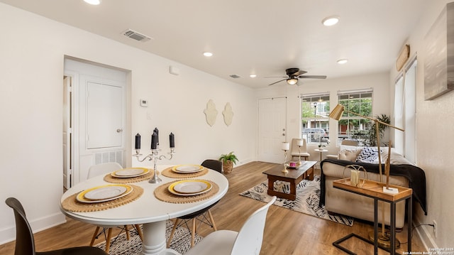 dining area featuring ceiling fan, wood finished floors, visible vents, and recessed lighting