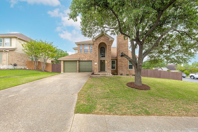 traditional home featuring brick siding, a front lawn, fence, and concrete driveway