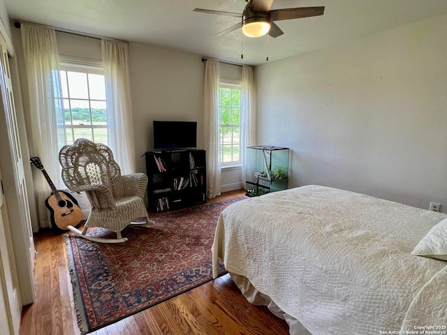 bedroom with wood finished floors and ceiling fan