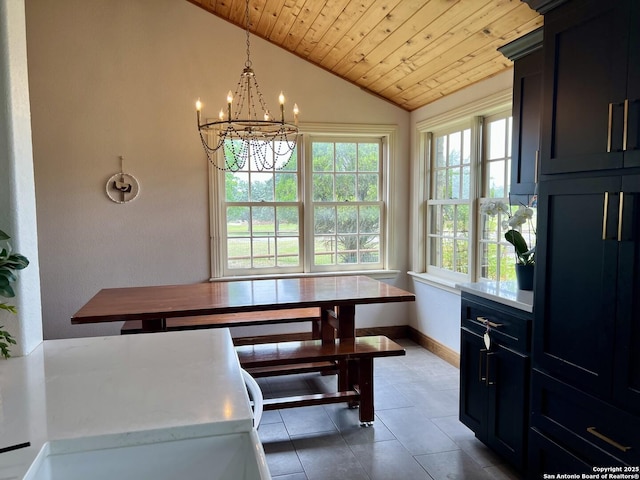 dining space featuring tile patterned floors, vaulted ceiling, baseboards, wood ceiling, and a notable chandelier