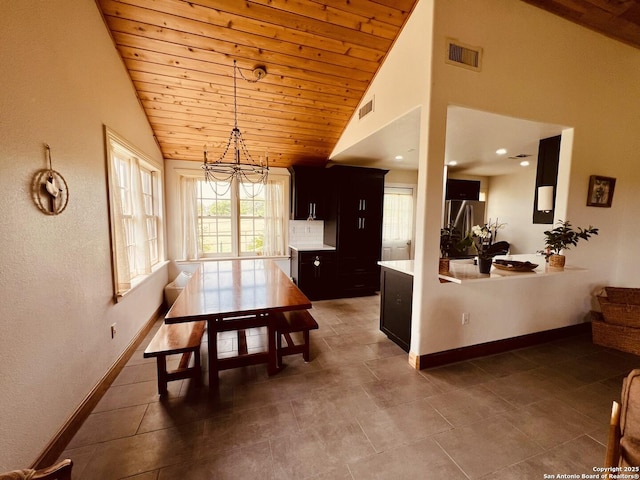 dining area featuring baseboards, wooden ceiling, visible vents, and a notable chandelier