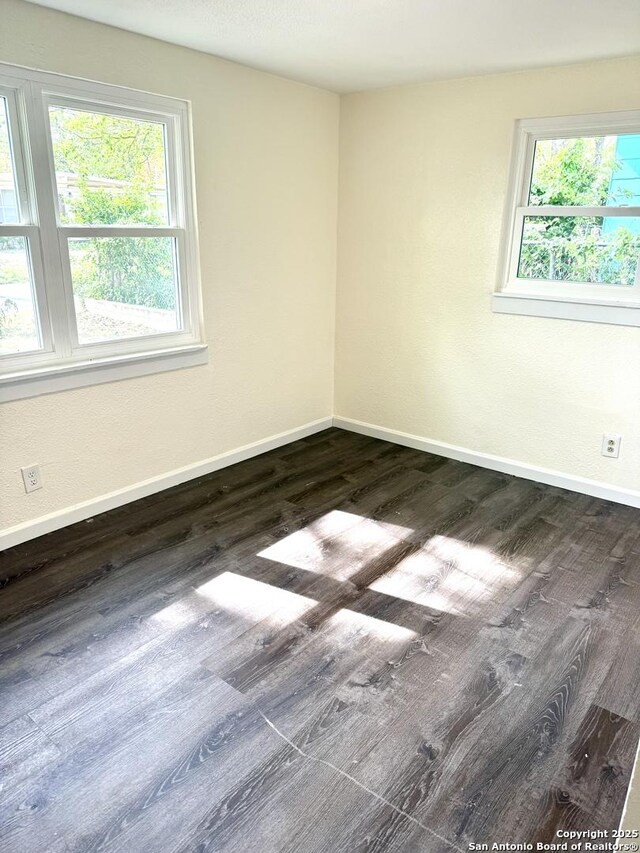 705 Short, Seguin, TX 78155 - empty room with dark wood finished floors and baseboards