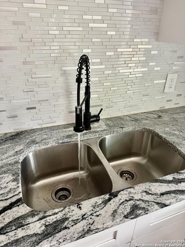 705 Short, Seguin, TX 78155 - interior details with a sink, backsplash, and light stone counters