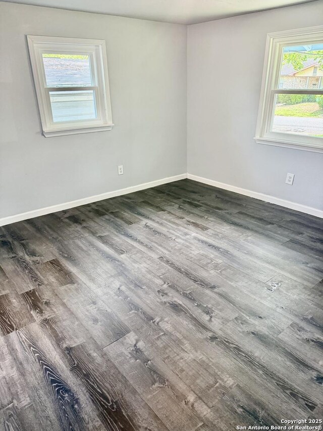 705 Short, Seguin, TX 78155 - empty room featuring wood finished floors and baseboards
