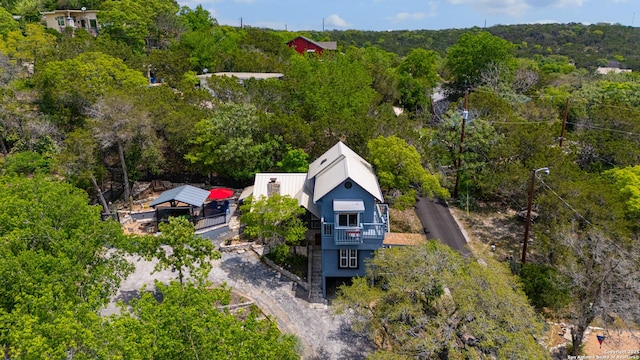 drone / aerial view featuring a view of trees
