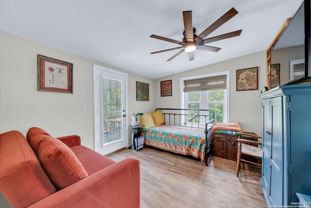 bedroom with ceiling fan, access to outside, and light wood-type flooring