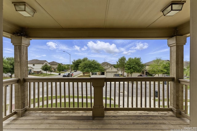 wooden deck with a residential view