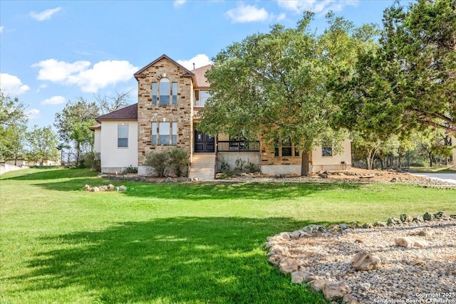 back of property featuring a yard
