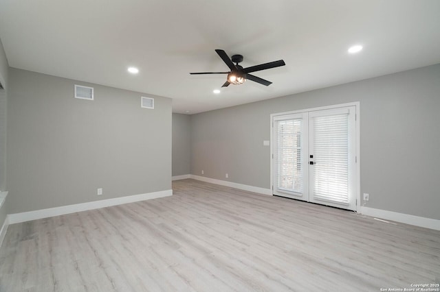 empty room with ceiling fan, wood finished floors, visible vents, and recessed lighting