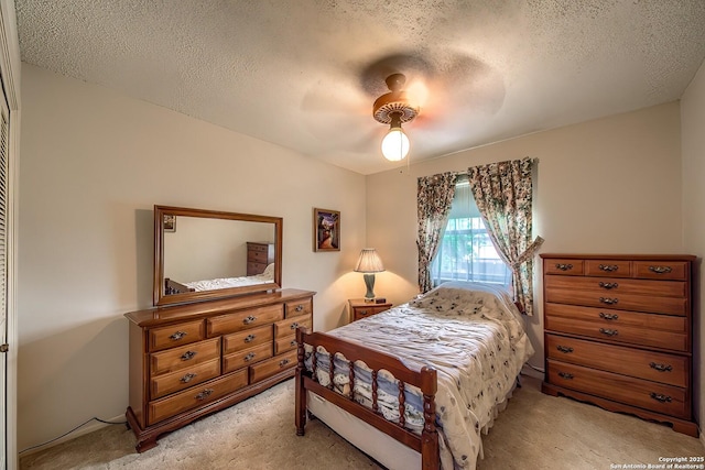 207 Mary Louise Dr, San Antonio, TX 78201 - bedroom featuring ceiling fan, a textured ceiling, and light carpet