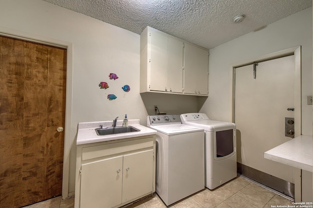 207 Mary Louise Dr, San Antonio, TX 78201 - clothes washing area featuring washer and clothes dryer, cabinet space, a sink, and a textured ceiling