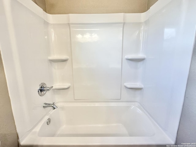 bathroom featuring a textured wall