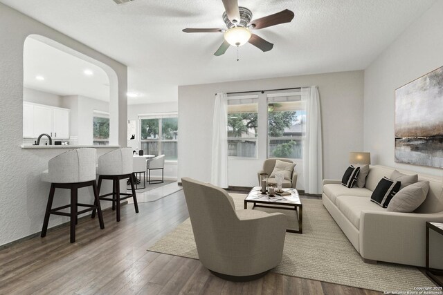 23102 Cardigan Chase, San Antonio, TX 78260 - living area with wood finished floors, a ceiling fan, a textured ceiling, and recessed lighting