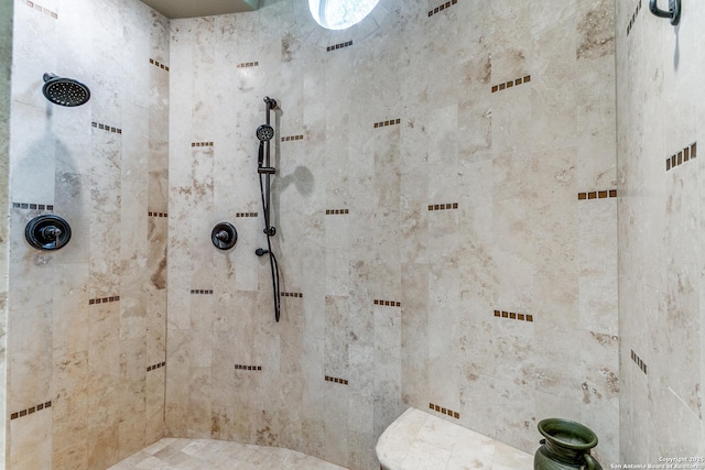 bathroom with tiled shower