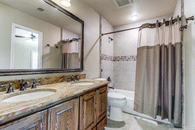 bathroom featuring visible vents, a sink, and double vanity