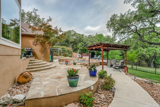 view of patio / terrace with a pergola and fence