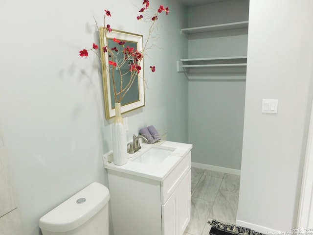 6023 Lark Valley Dr, San Antonio, TX 78242 - bathroom featuring vanity, marble finish floor, and toilet