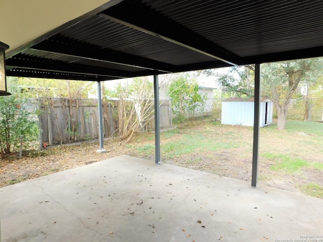 6023 Lark Valley Dr, San Antonio, TX 78242 - view of patio / terrace featuring a fenced backyard, an outbuilding, and a storage shed