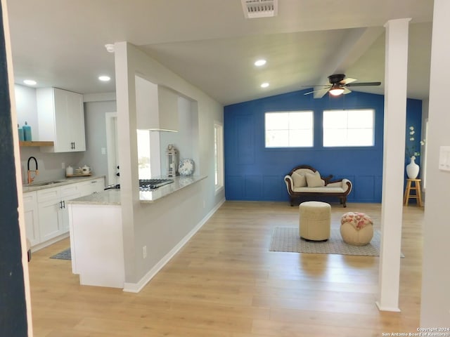 6023 Lark Valley Dr, San Antonio, TX 78242 - kitchen featuring light wood finished floors, a ceiling fan, white cabinets, and a sink