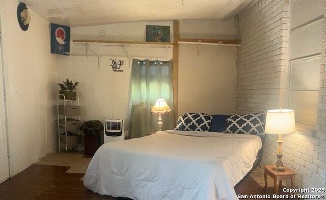 bedroom featuring wood finished floors