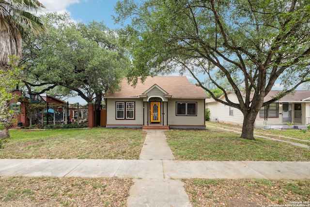 bungalow with a front yard