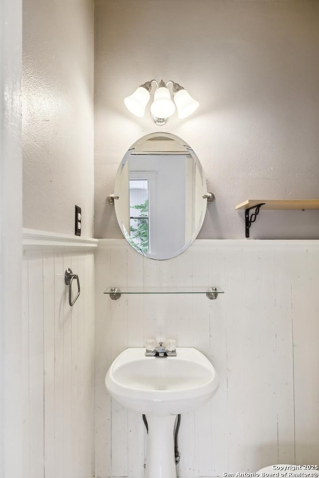 bathroom featuring a wainscoted wall