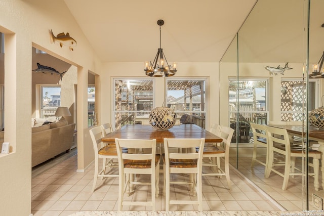dining room featuring vaulted ceiling, an inviting chandelier, and light tile patterned floors
