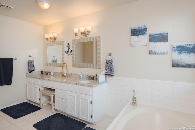 bathroom with tile patterned floors, a sink, double vanity, and a bathing tub