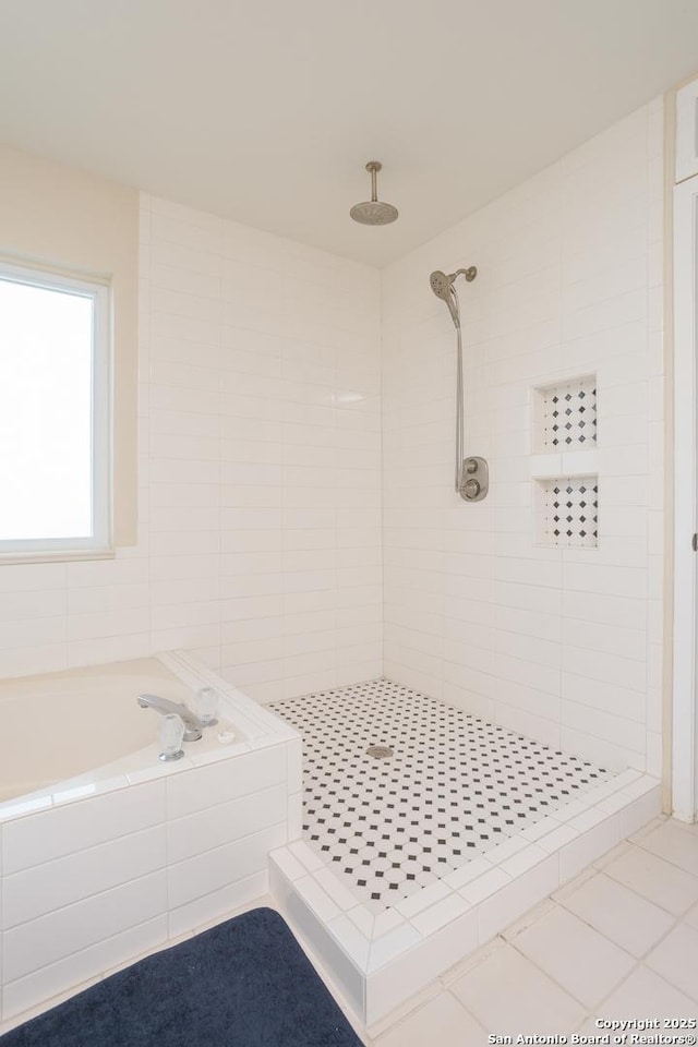 full bathroom with a shower stall, a garden tub, and tile patterned flooring