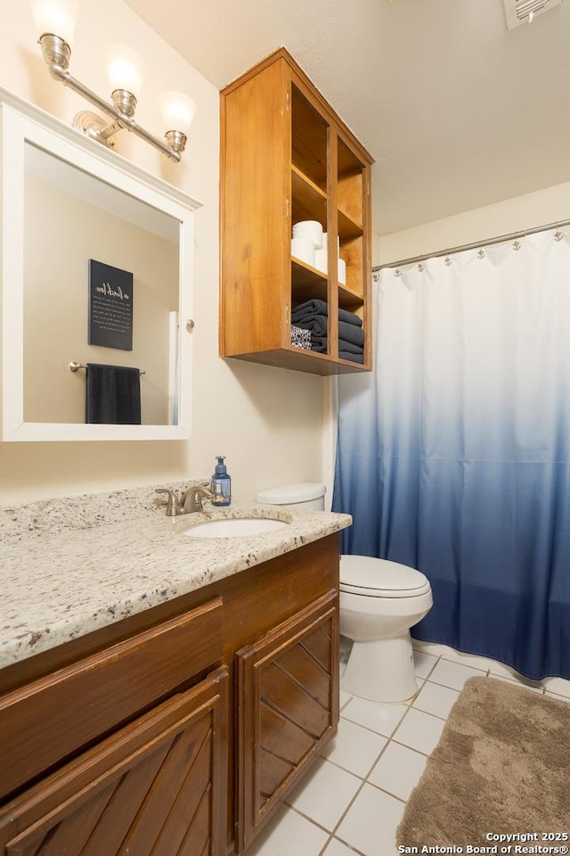bathroom featuring curtained shower, tile patterned floors, visible vents, toilet, and vanity