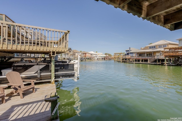 view of dock featuring a water view and boat lift